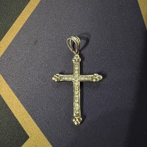 Sterling Silver cross with CZ stones.